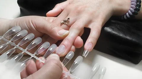 Step-by-step instructions for nail extension on gel tips. Manicure, hands in  Foto stock