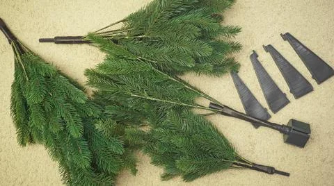 Step by step instructions.step 2 assembling an artificial Christmas tree. pho Stock Photos