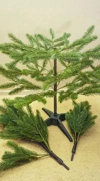 Step by step instructions.step 4 assembling an artificial Christmas tree. pho Stock Photos