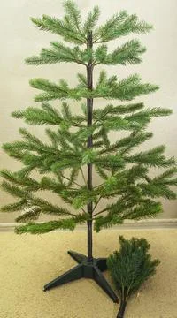 Step by step instructions.step 5 assembling an artificial Christmas tree. pho Stock Photos