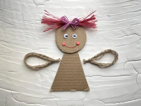 Step by step, learning how to make an angel doll out of cardboard Stock Photos