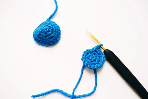 Step-by-step master class on crocheting a two-color heart. step 7. finish Stock Photos