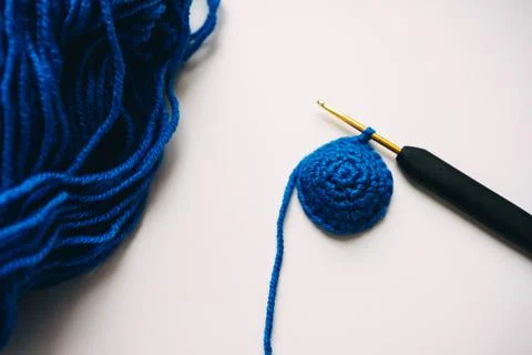 Step-by-step master class on crocheting a two-color heart. step 7. finish Stock Photos