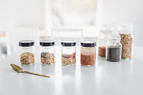 Step by step meal prepping of overnight oats with cocoa and chia seeds, hea.. Stock Photos