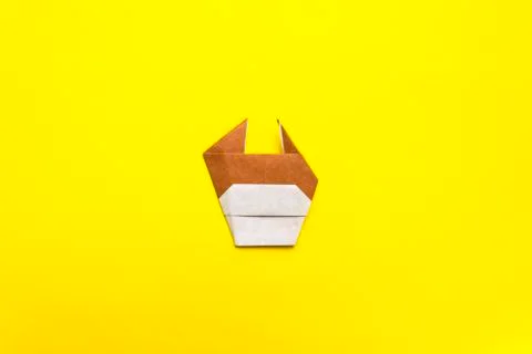 Step by step photo instruction how to make origami paper bull. The bull is th Stock Photos