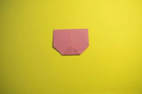 Step by step photo instruction how to make origami paper pig. Simple diy ki.. Stock Photos