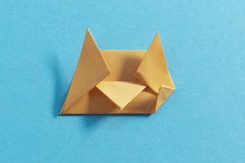 Step by step photo instruction how to make origami paper kitty. Simple diy kids Stock Photos