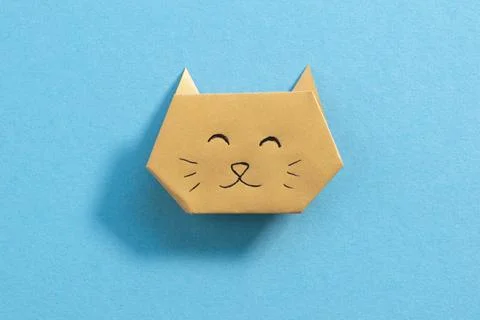 Step by step photo instruction how to make origami paper kitty. Simple diy kids Stock Photos
