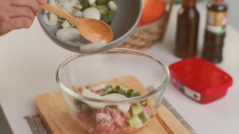 Step-by-step procedures for marinating pork for easy Korean cooking. Stock Footage 242549791