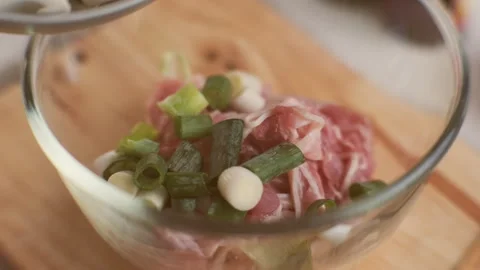 Step-by-step procedures for marinating pork for easy Korean cooking. Stock Footage 242550034