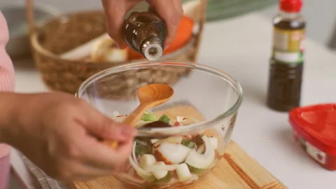 Step-by-step procedures for marinating pork for easy Korean cooking. Stock Footage 242550612