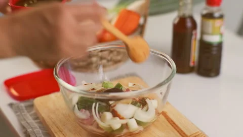 Step-by-step procedures for marinating pork for easy Korean cooking. Stock Footage 242550947