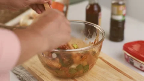 Step-by-step procedures for marinating pork for easy Korean cooking. Stock Footage 242551400