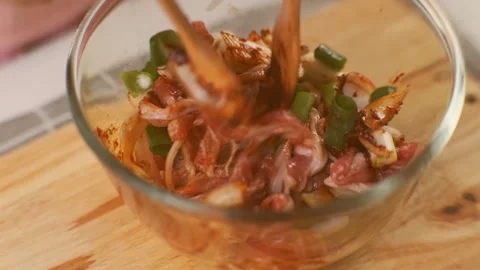 Step-by-step procedures for marinating pork for easy Korean cooking. Stock Footage 242551411