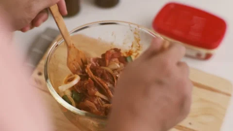 Step-by-step procedures for marinating pork for easy Korean cooking. Stock Footage 242551548