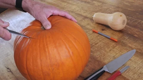 Step-by-step process of carving pumpkin into jack-o’-lantern for Halloween Stock Footage 316735186