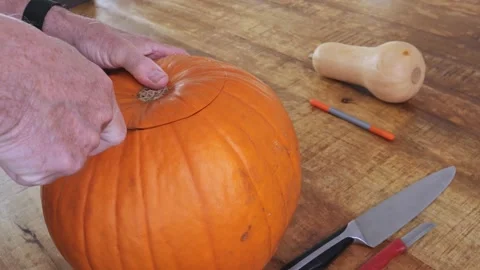 Step-by-step process of carving pumpkin into jack-o’-lantern for Halloween Stock Footage 316824946