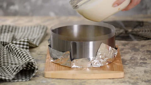 Step by step process of making a modern mousse cake. Pouring white chocolate Stock Footage 124838569