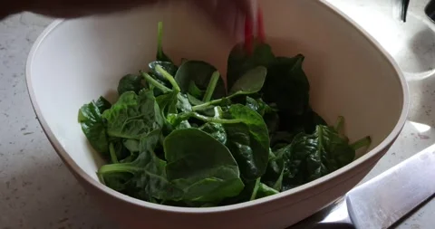 A step-by-step process of preparing a fresh, colorful salad Stock Footage 325975049