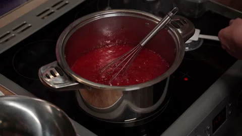 Step-by-step process of preparing syrup for Christmas cake Stock Footage 166317415