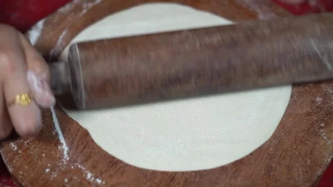 Step by Step Process of Shaping Large Flatbread Dough with Wooden Belan. Stock Footage 339870782