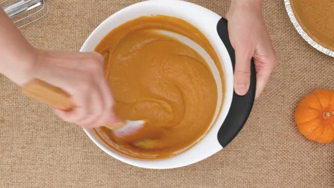 Step by step pumpkin pie recipe. Pumpkin puree in a bowl Stock Footage 160375113