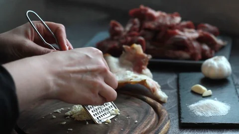 Step-by-step recipe for pork knuckle roll, woman cook rubs garlic Stock Footage 126768329