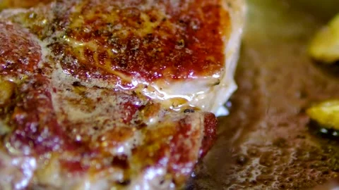 Step by step ribeye steak recipe with garlic butter cooked on stainless steel Video stock 346181382