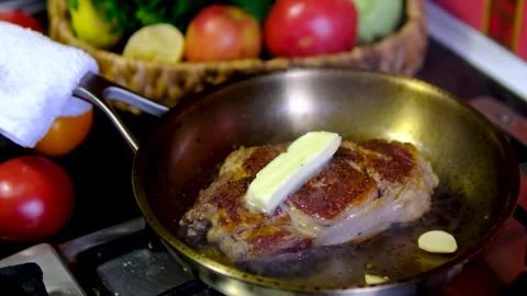 Step by step ribeye steak recipe with garlic butter cooked on stainless steel Video stock 346182123