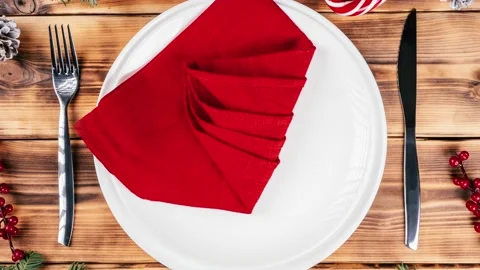 Step-by-step stop motion video tutorial: How to fold linen napkin in shape of Stock Footage 164443595