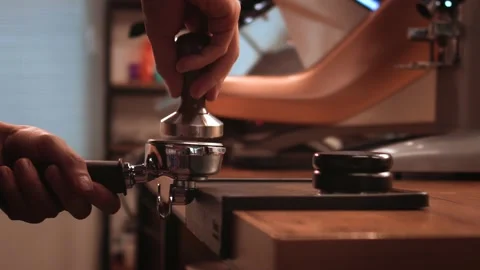 Step by step training from scratch how to prepare tasty coffee. Pressing Stock Footage 147103360