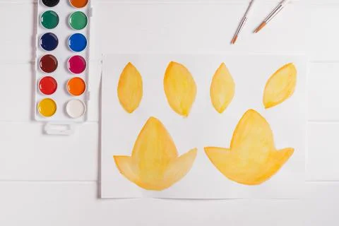 Step-by-step tutorial autumn wreath. Step 1: Paint autumn leaves different sh Stock Photos