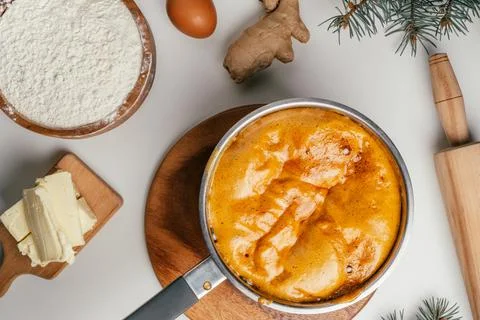 Step-by-step tutorial on baking Christmas gingerbread cookies. Step 5: Stir u Stock Photos