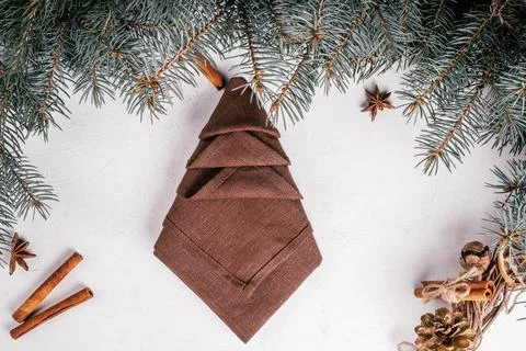 Step-by-step tutorial: Fold linen napkin in shape of Christmas tree. New Year Stock Photos