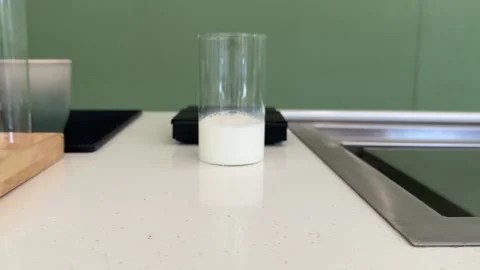 Step by step tutorial making Japanese matcha tea. Step one , putting green Stock-Footage 322106669