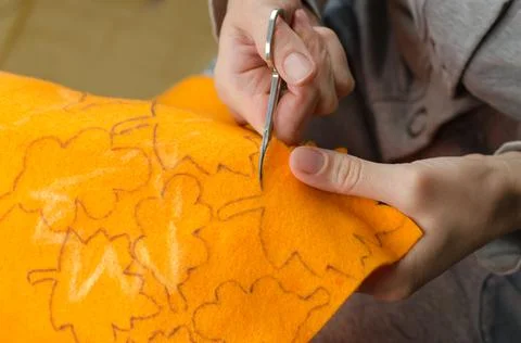 Step by step a woman cuts maple leaves from felt Stock Photos