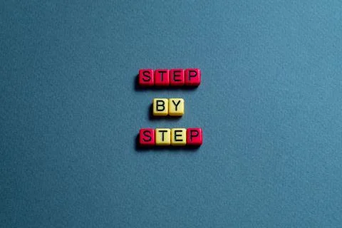 Step by step - word concept on cubes, text Stock Photos