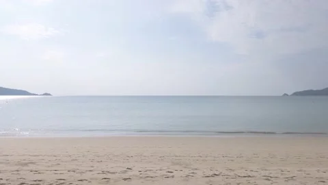 Step walking on the white sand beach in sunshine daytime in slowmotion Stock Footage 148035860