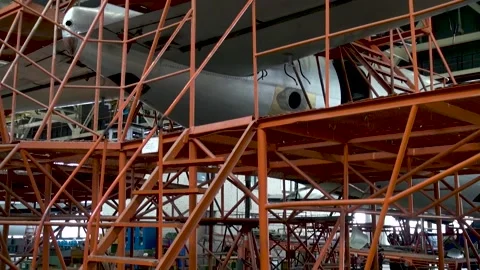 Stepladders for repairing tail of Il-18 aircraft. Maintenance aircraft Il-18. Stock Footage 135258065