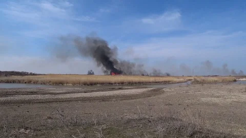 The steppe burns by the river Stock Footage 126761022
