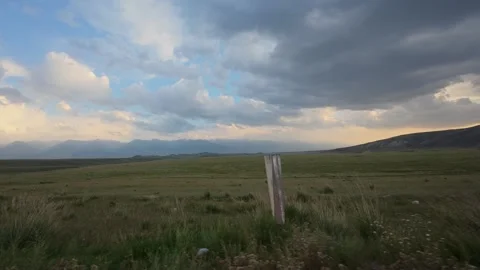 Steppe evening clouds seen from a car, At-Bashy District, Kyrgyzstan Video stock 347242796