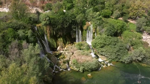 Stepped Kravica Waterfalls Dropping into Clear Rock Pool. Bosnia and Herzegovina Stock Footage 345839481