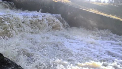 Stepped waterfall, strong stream, splashing water in the sun. With sound Stock Footage 151550582