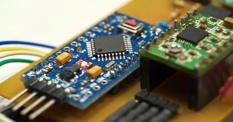 Stepper Motor Driver. Small electronic circuit with burning red LED light bulb Stock Footage 277348296