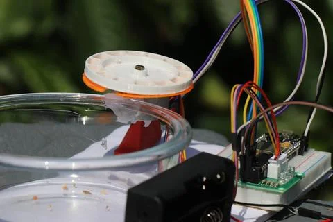 Stepper motor shaft connected to a 3d printed food dispenser Stock Photos
