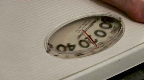 Stepping onto a Bathroom Scale - Gauge Close-Up Video stock 62794177
