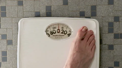 Stepping onto a Bathroom Scale - Medium Shot Video stock 62794203