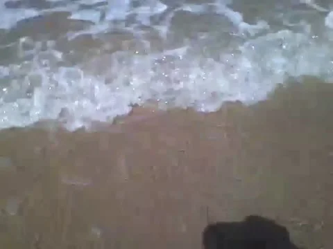 Stepping on the beach sand and receiving the sea foam on feet, amazing! Stock Footage 158963252