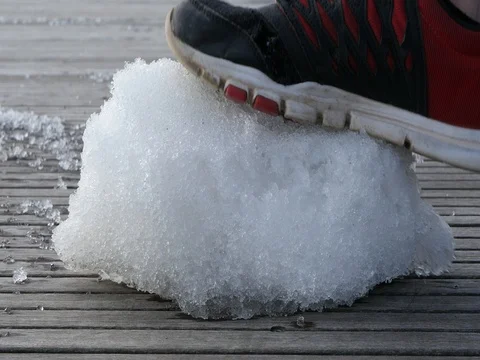 Stepping on Crunchy Ice Stock Footage 74600033