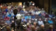Stepping Up To The Microphone In Front Of Crowd Pov Stock Footage
